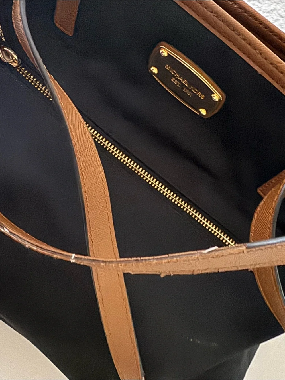 Michael Kors Black Tote with Brown Trim and Gold Plate